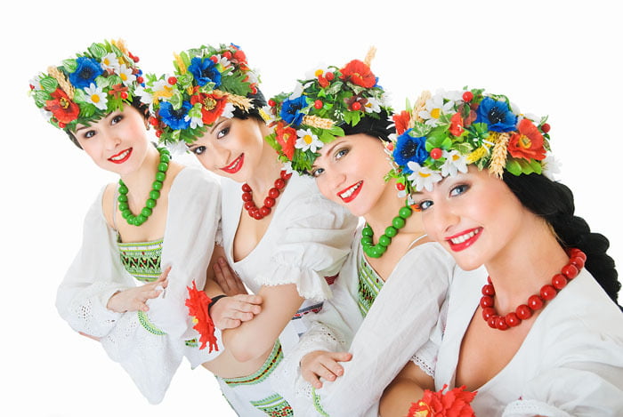 four ukrainian young women dancers on white
